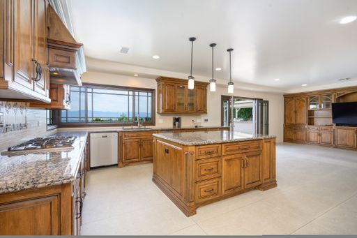 A luxurious kitchen with spacious island in a grand residence in Encino, California