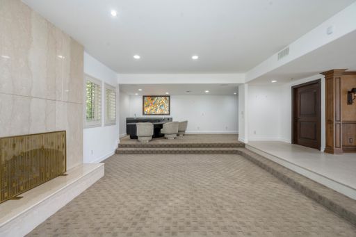 Spacious living room with fireplace and furniture