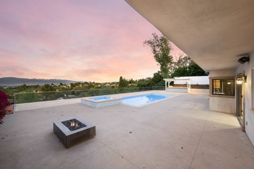 A home pool with outdoor seating area in California