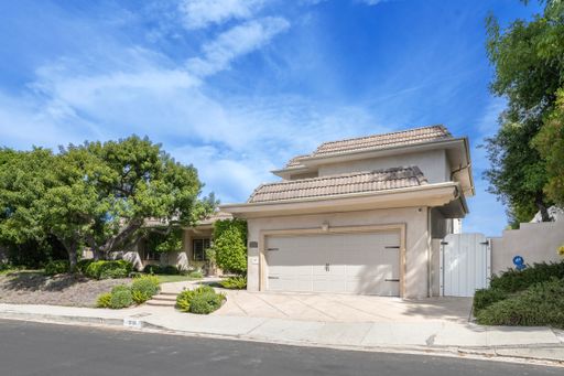 A residential home with two side garages and one house in California