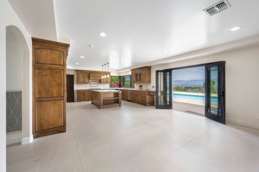 A kitchen in enclosed poolside space in California