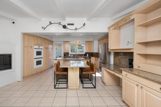 A modern and organized kitchen with ample cabinets