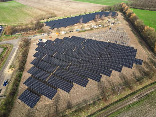 An aerial view of solar panels on a roof of a building in Germany