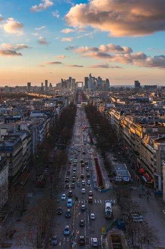 A beautiful aerial view of the road with the cars and the cityscape of Paris, France