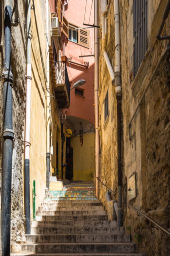 A beautiful shot of an alleyway with the stairs in the old town of Sciacca, Sicily, Italy