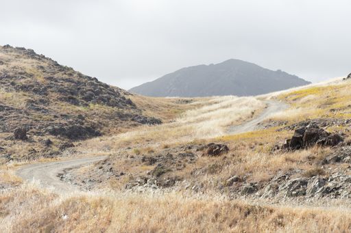 A narrow path through hills and mountains