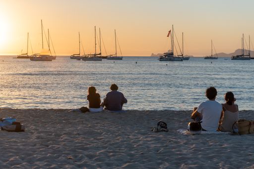 Formentera, Spain: 2021 June 23: Young people enjoy the sunset on the beach in Cala Saona in Formetera in summer 2021