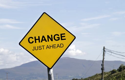 Yellow road sign with the words "CHANGE - JUST AHEAD" on it