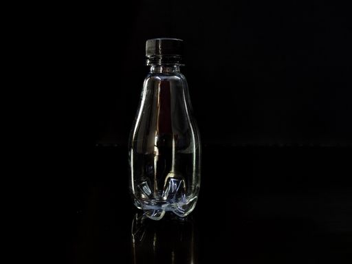 A closeup shot of an empty plastic bottle on an isolated background