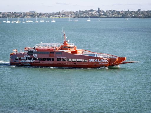 Aerial view of Sealink passenger car ferry riding to Waiheke island from Half Moon Bay. Auckland, New Zealand - June 21, 2021