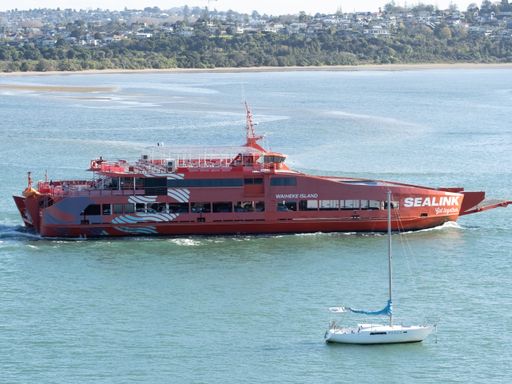 Aerial view of Sealink passenger car ferry riding to Waiheke island from Half Moon Bay. Auckland, New Zealand - June 21, 2021