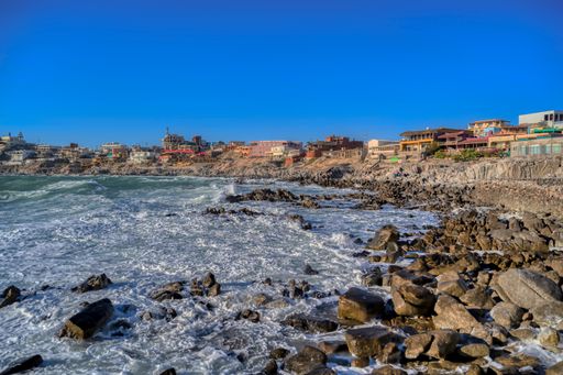 Rocky beach with ocean waves on a sunny day