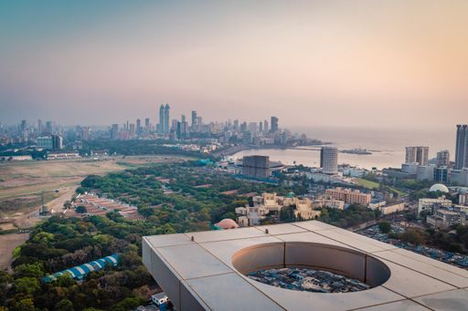 The Aerial view of the Mumbai city skyline at sunset with glowing light