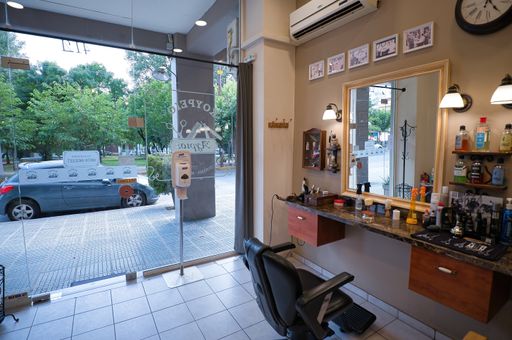 Men's barber shop, retro styled interior design ,  shot of empty chairs in retro styled barbershop. Hair salon interior.Volos ,Greece 6-25-2021