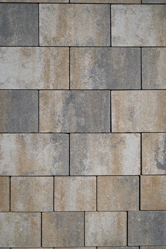 A vertical shot of a patterned stone wall - perfect for mobile