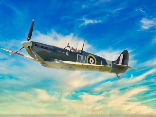 WW2 Supermarine Spitfire climbing in blue sky