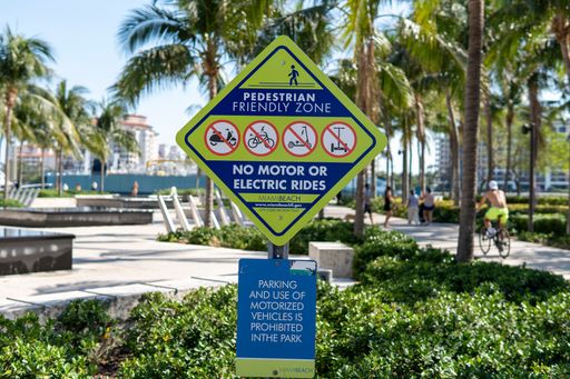 Sign in Miami Beach, FL designates pedestrian-friendly area, prohibiting motorized or electric vehicles