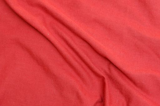 A top view closeup of a wrinkled red cloth texture for a background