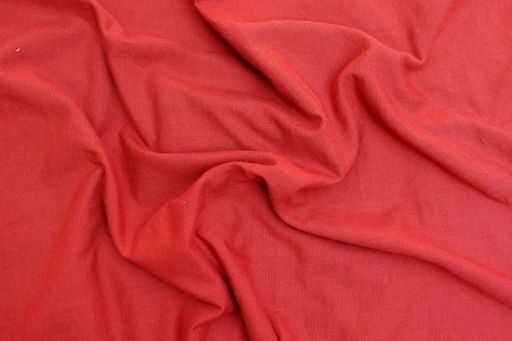 A top view closeup of a wrinkled red cloth texture for a background