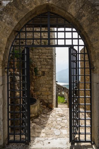 A vertical closeup shot of the gates of Caccamo Castle in Sicily, Italy