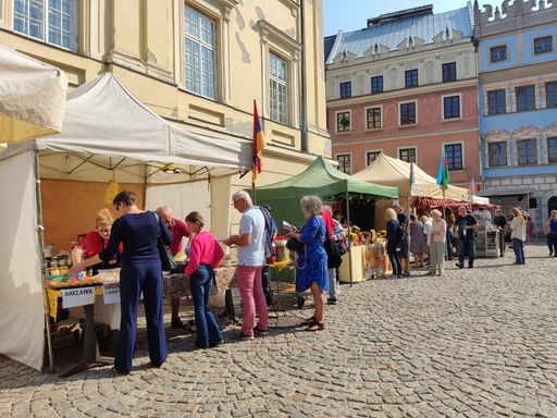 Some people enjoying the local weekend street food market in the city of Lublin, Poland