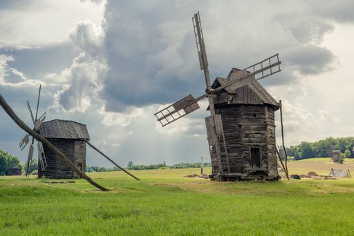 Old windmills in a green field