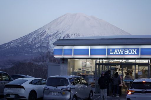 A scenic view of Lawson store with Mount Yotei backdrop in Niseko.