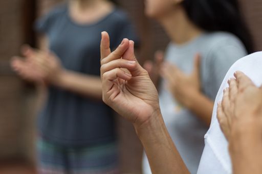 The people doing percussion with their bodies. A hand in the foreground making a clicking sound