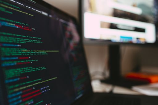 A closeup of computer code on the screen with a blurry background
