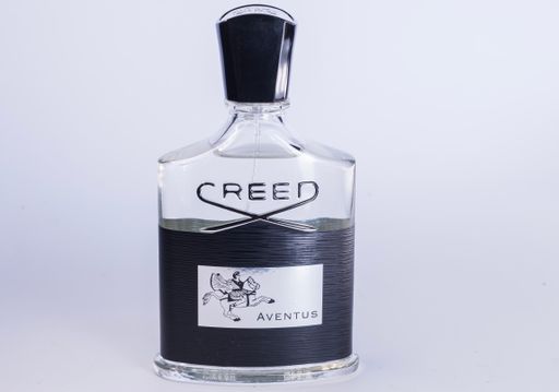 Close-up of a perfume bottle on a table