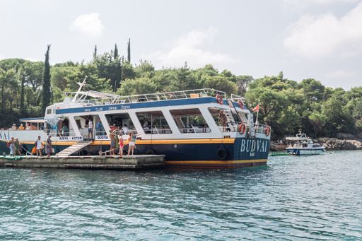 Montenegro, Budva - July 20, 2020:boarding tourists on the excursion ferry from the pier in the gulf of the Adriatic Sea