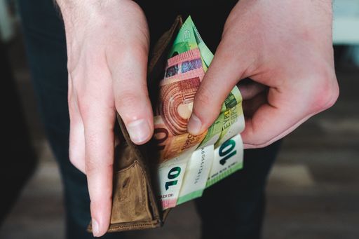 A closeup shot of an open wallet with Euro banknotes