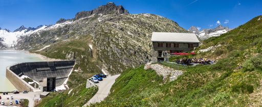 A panoramic shot of an alpine refuge near Oberaarsee dam in the Bernese Alps in Switzerland
