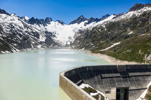 A beautiful shot of Oberaarsee dam and Oberaar glacier in Valais, Switzerland