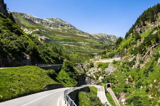 An hairpin and serpentine road to Grimsel Pass viewed from Upper Valais near Gletsch, Switzerland
