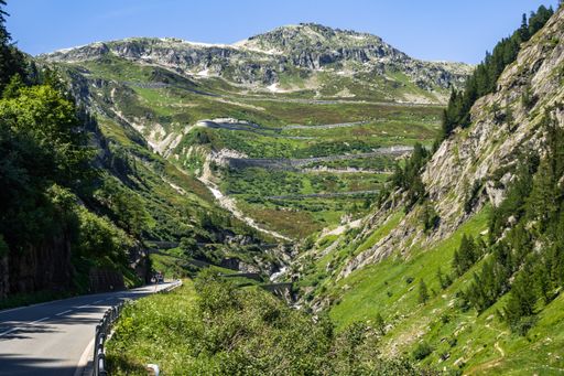 An hairpin and serpentine road to Grimsel Pass viewed from Upper Valais near Gletsch, Switzerland