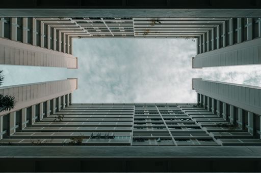 A low angle shot of a residential building with spacious balconies