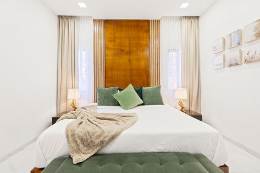 A luxury vacation home surrounded by two framed pictures