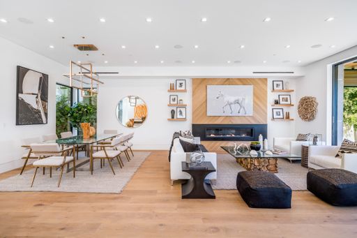 Stylish living and dining area with wooden floors