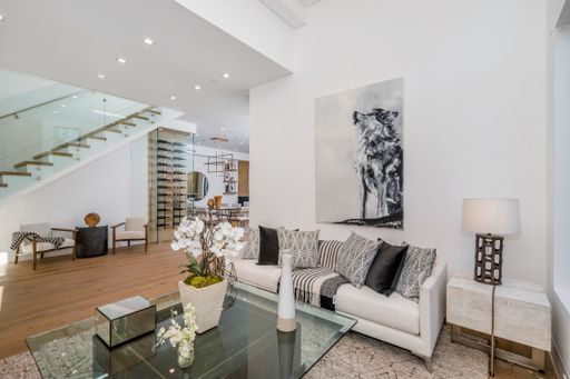 A cozy living room with a set of table and chairs