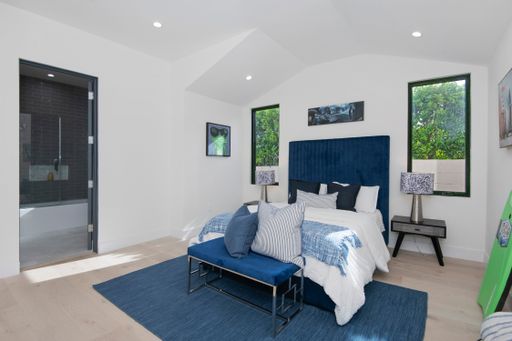 A neat, tidy room set up for rest in a modern new construction home in Los Angeles