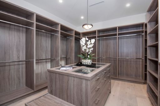 A spacious walk-in closet with ample storage in a modern new construction home in Los Angeles