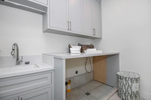 The interior of a laundry room in a modern new construction home in Los Angeles