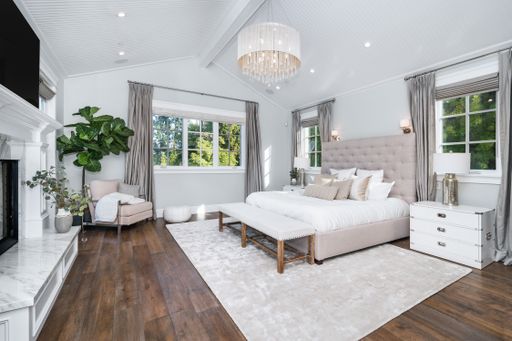A well-furnished bedroom in a new construction home in Encino, California