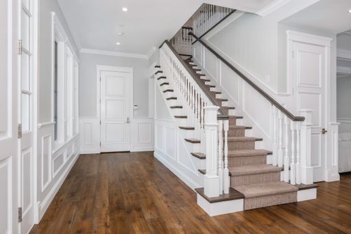 A wooden staircase in a new construction home in Encino, California