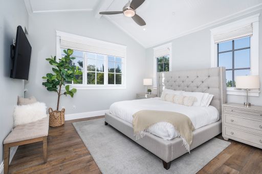 A well-furnished bedroom in a new construction home in Encino, California