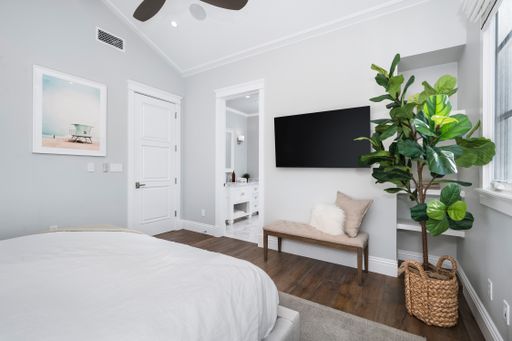 A well-furnished bedroom in a new construction home in Encino, California