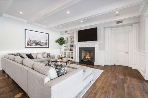 A cozy living room with sofas in a new construction home in Encino, California