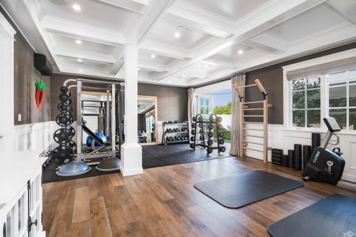 A gym with diverse workout equipment like treadmills and exercise mats