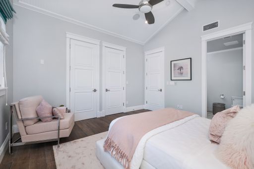 A well-furnished bedroom in a new construction home in Encino, California